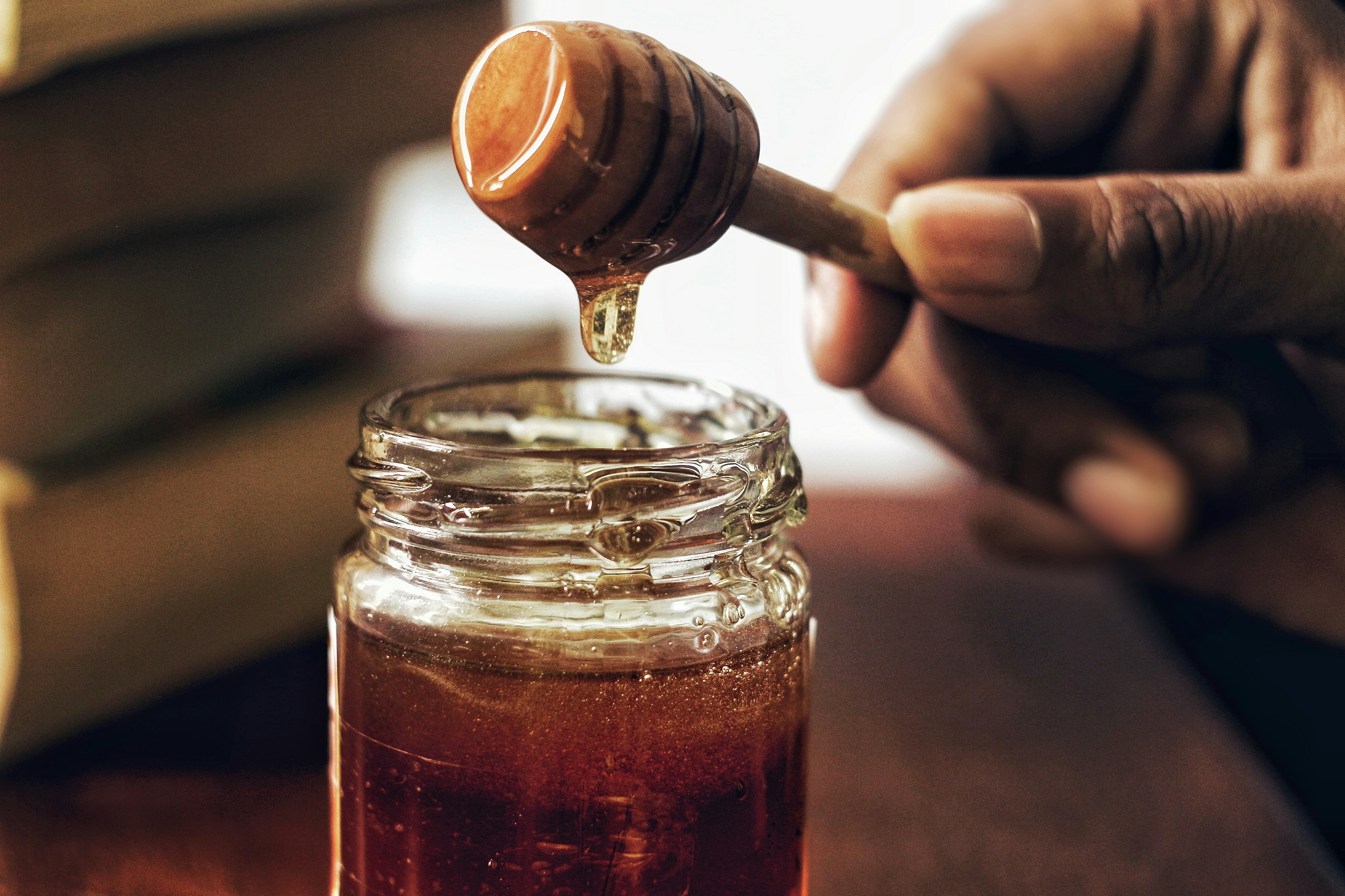 calories in half cup sugar — white granulated sugar in measuring cup with nutrition facts